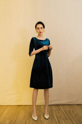 Elegant velvet midi dress with pearl-trimmed sleeves and boat neckline